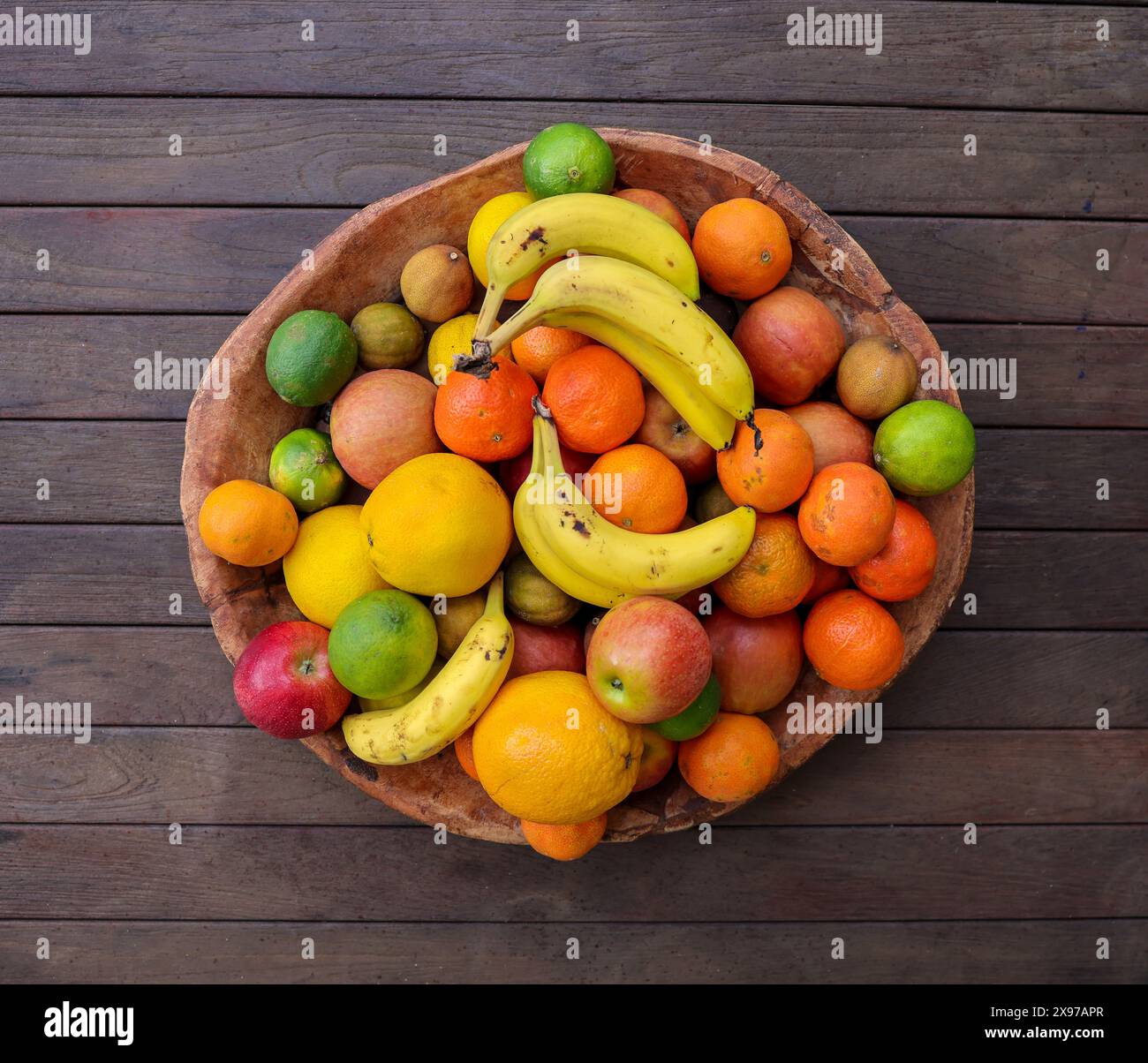 Huge bowl full of colorful and tasty fruits. There are lots of vitamins in one plate Stock Photo