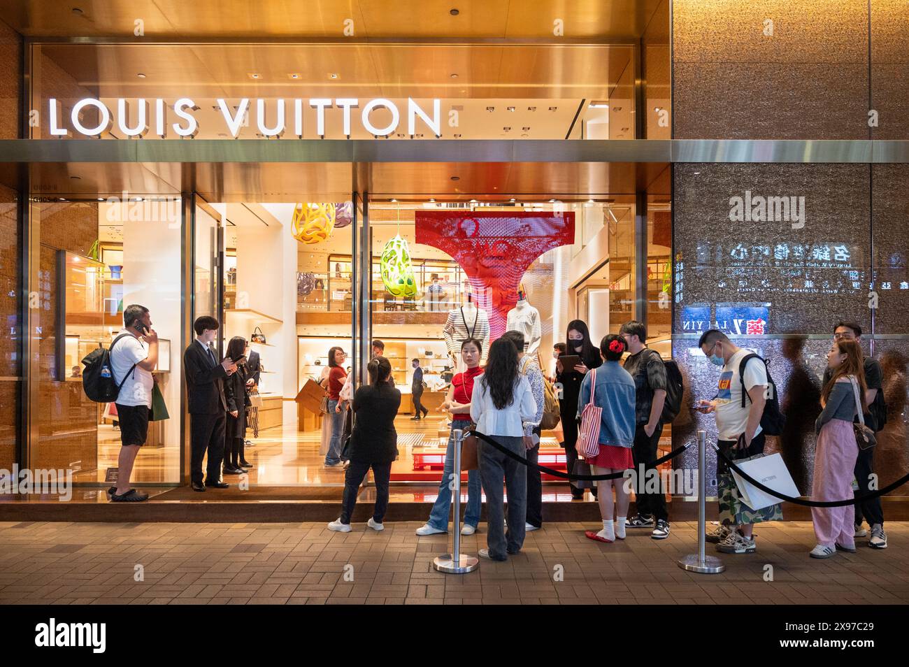 Hong Kong, China. 29th May, 2024. Shoppers queue in line to enter the ...