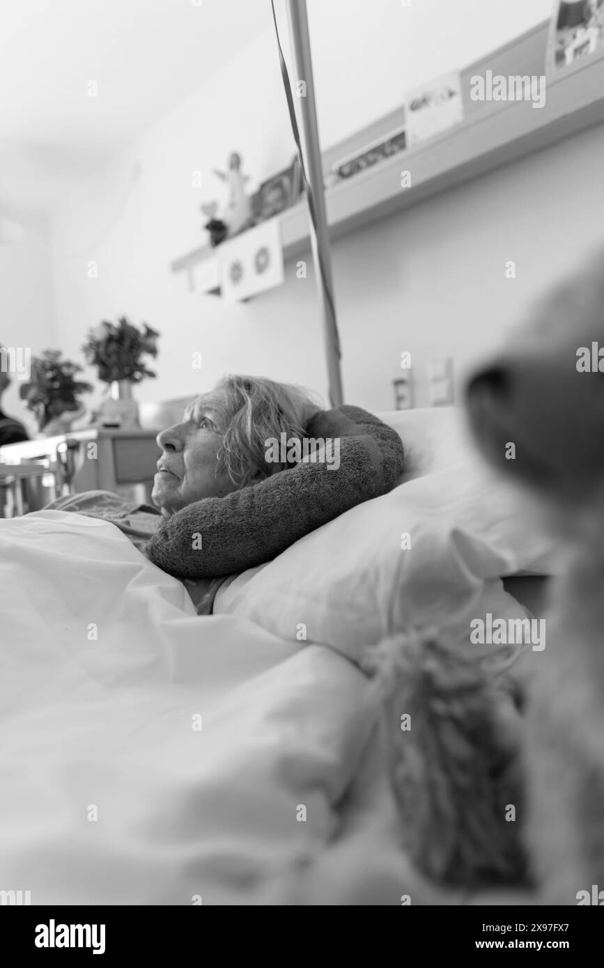 Senior citizen with dementia lying in her room in a retirement home, portrait, Baden-Wuerttemberg, Germany Stock Photo