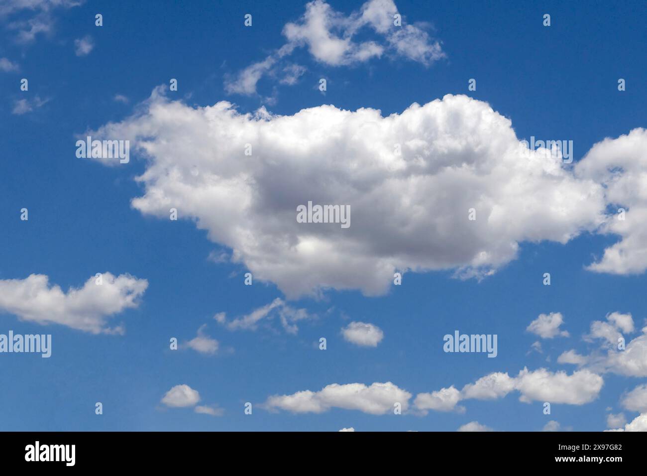 White clouds cumulus in front of blue sky, international Stock Photo