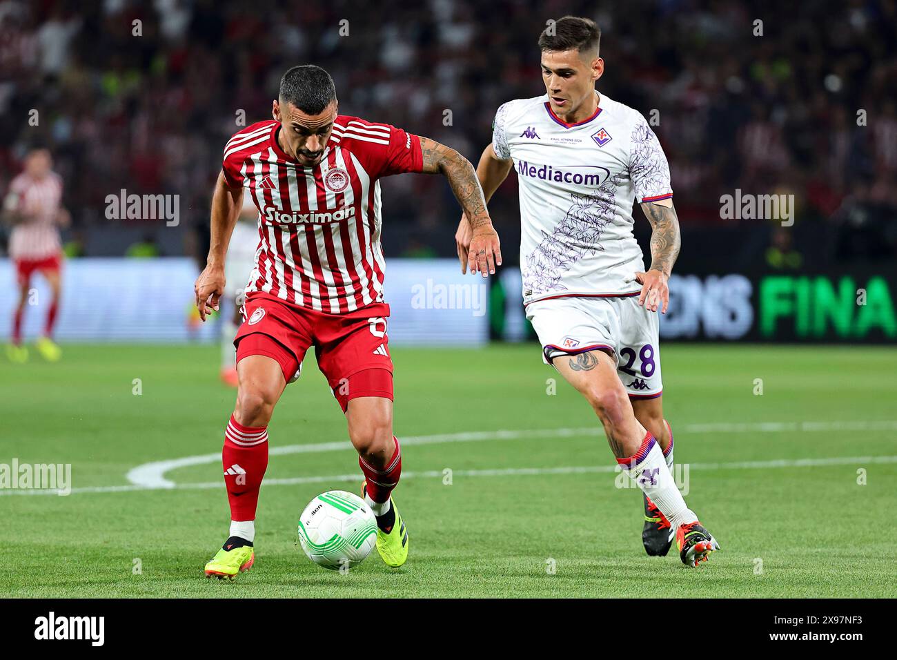 Athens, Greece. 29th May, 2024. Francisco Leonel Lima Silva Machado Chiquinho of Olympiacos FC and Lucas Martinez Quarta of ACF Fiorentina during the 2023/2024 Conference League Final football match between Olympiacos FC and ACF Fiorentina at AEK Arena stadium in Athens (Greece), May 29th, 2024. Credit: Insidefoto di andrea staccioli/Alamy Live News Stock Photo