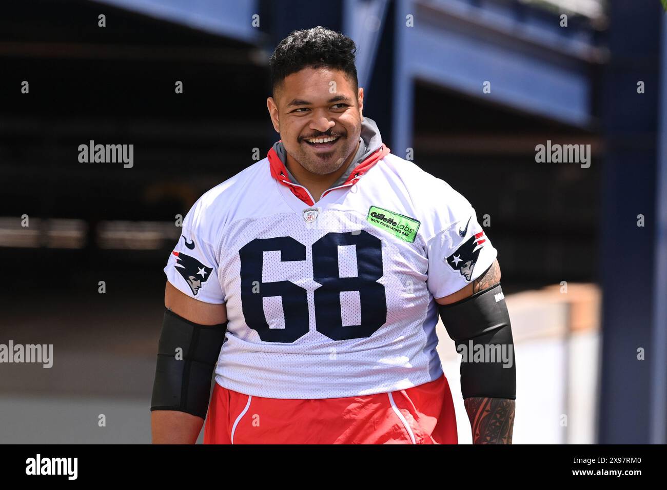 Foxborough, Massachusetts, USA. 29th May, 2024. New England Patriots guard Atonio Mafi (68) walks to the practice field for the team's OTA's at Gillette Stadium, in Foxborough, Massachusetts. MANDATORY CREDIT: Eric Canha/CSM/Alamy Live News Stock Photo