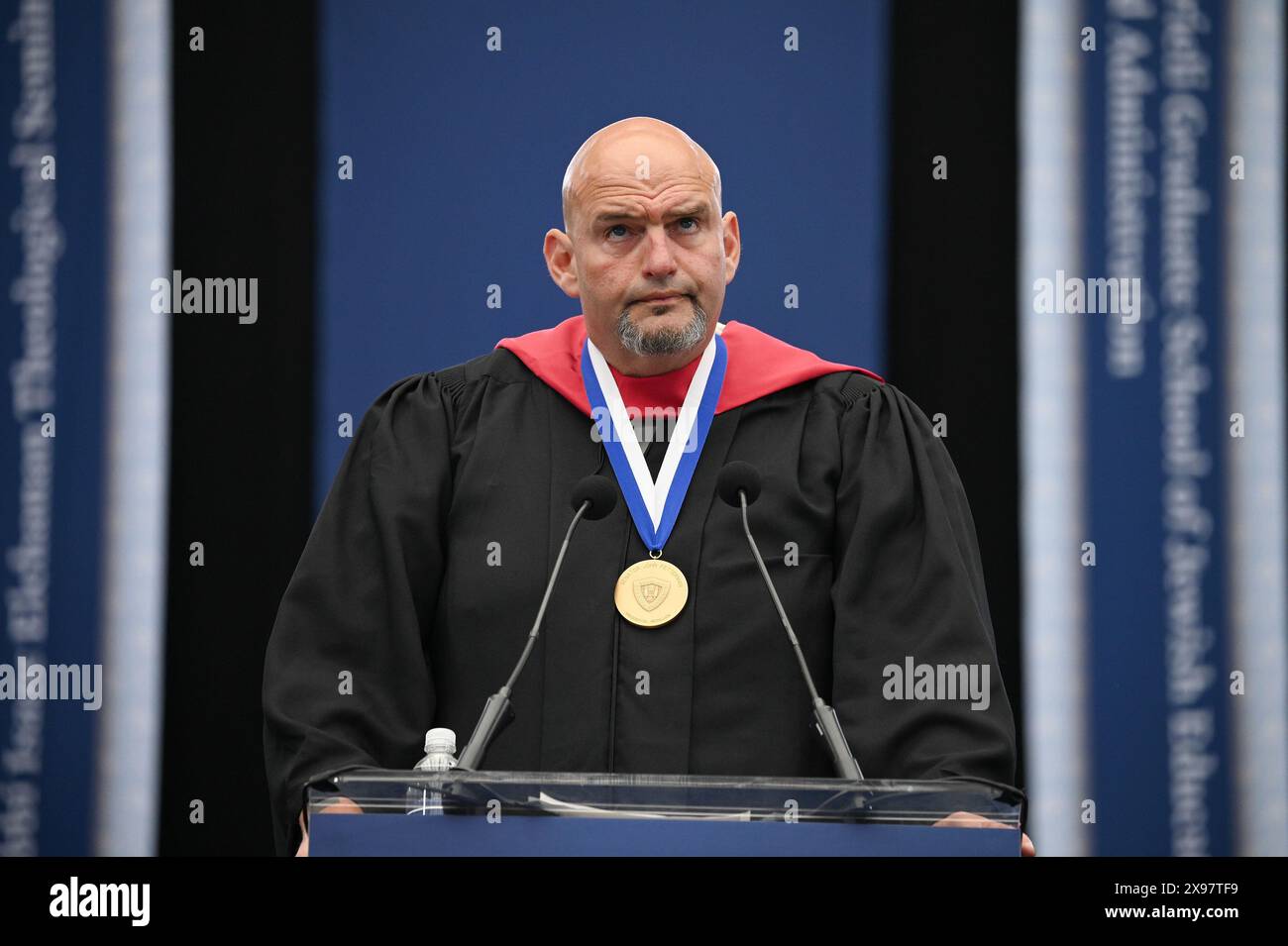 New York, USA. 29th May, 2024. Senator John Fetterman (D-PA) speaks at the commencement ceremony for 2024 Yeshiva University graduating class, at the USTA Billie Jean King National Tennis Center's Louse Armstrong Stadium, Flushing Meadow-Corona Park, Queens, NY, May 29, 2024. (Photo by Anthony Behar/Sipa USA) Credit: Sipa USA/Alamy Live News Stock Photo