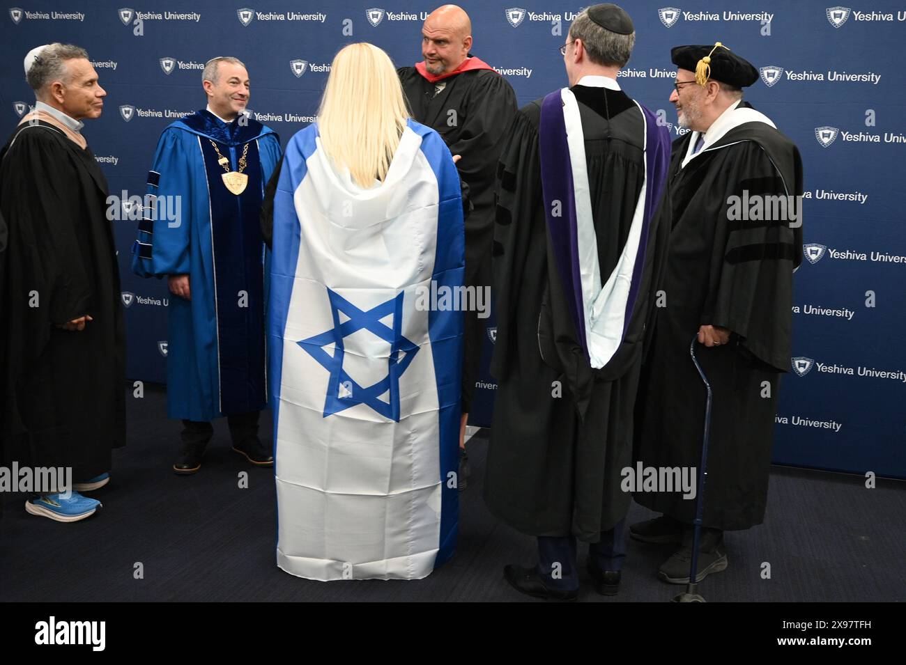 New York, USA. 29th May, 2024. Senator John Fetterman (red sash) (D-PA) attends the commencement ceremony for 2024 Yeshiva University graduating class, at the USTA Billie Jean King National Tennis Center's Louse Armstrong Stadium, Flushing Meadow-Corona Park, Queens, NY, May 29, 2024. (Photo by Anthony Behar/Sipa USA) Credit: Sipa USA/Alamy Live News Stock Photo