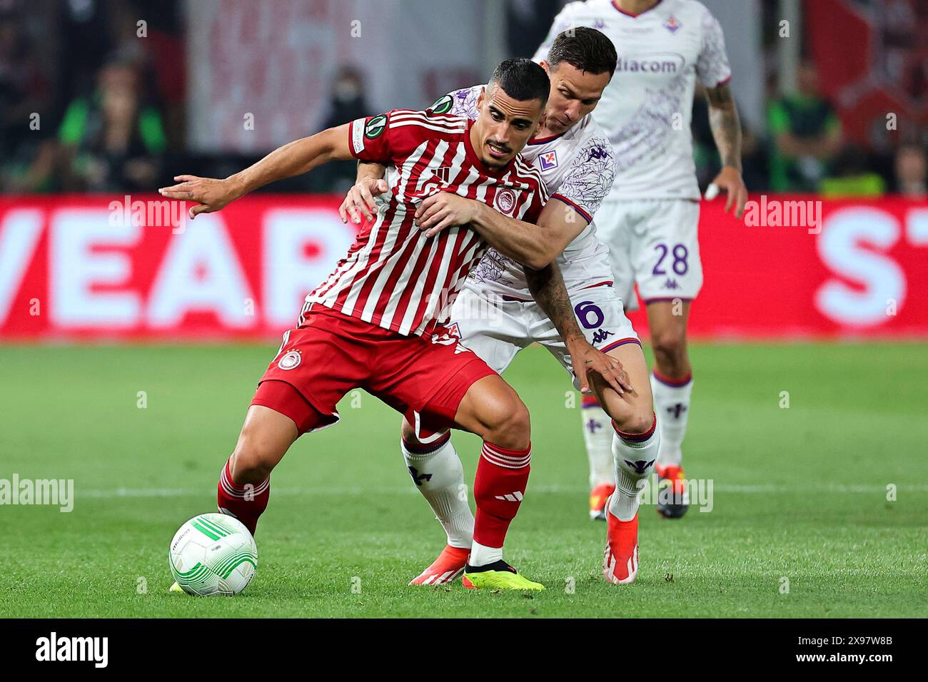 Athens, Greece. 29th May, 2024. Francisco Leonel Lima Silva Machado Chiquinho of Olympiacos FC and Arthur Melo of ACF Fiorentina during the 2023/2024 Conference League Final football match between Olympiacos FC and ACF Fiorentina at AEK Arena stadium in Athens (Greece), May 29th, 2024. Credit: Insidefoto di andrea staccioli/Alamy Live News Stock Photo