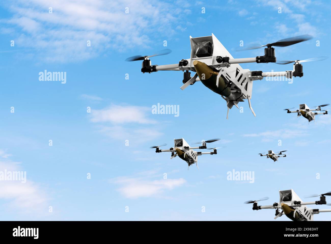 Military kamikaze drones with aerial bombs fly in front of blue sky. War of drones. Unmanned aerial vehicle. Stock Photo