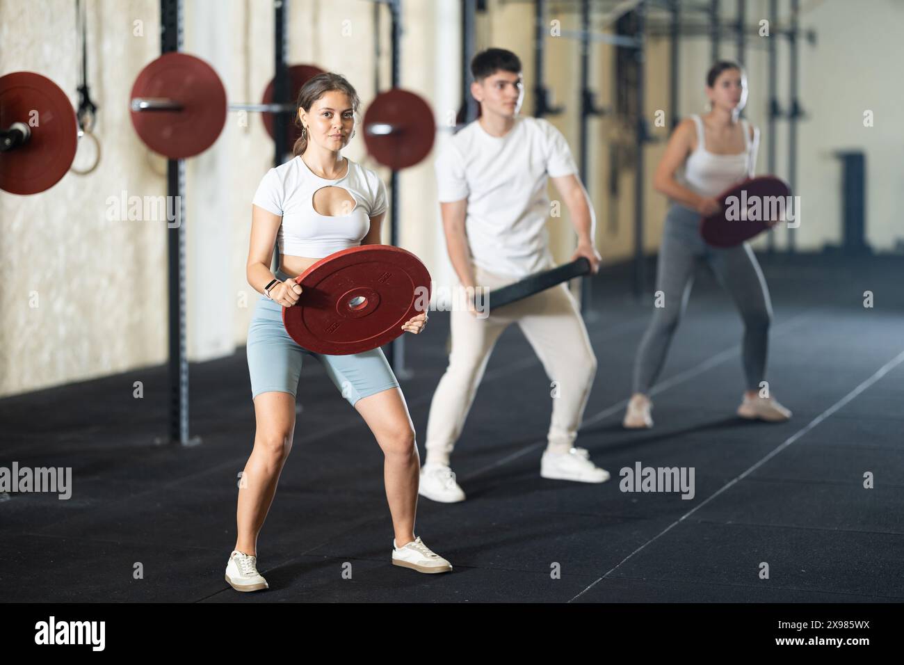 Group of young people doing sports and crossfit in modern gym Stock ...
