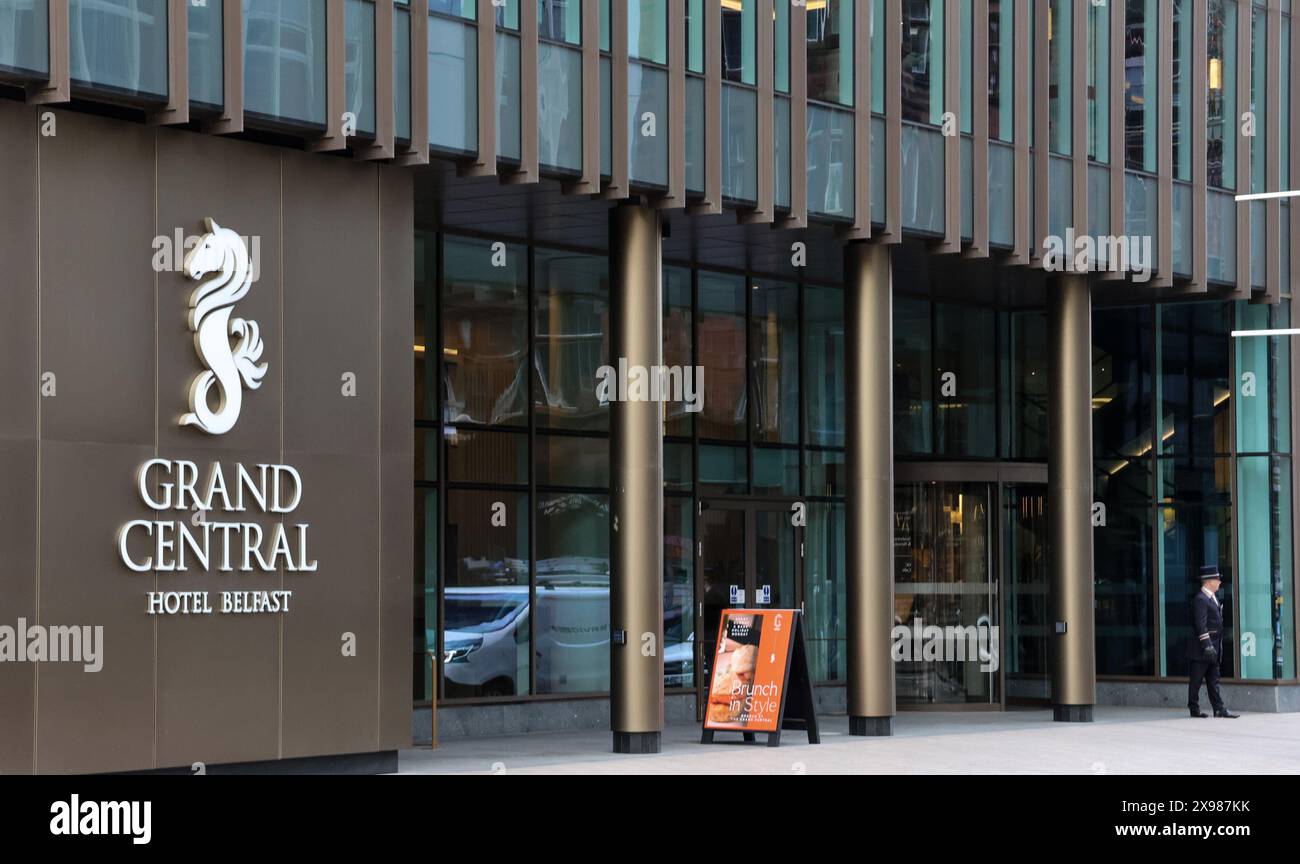 Grand Central Hotel Belfast concierge outside main entrance on Bedford Street Belfast Stock Photo