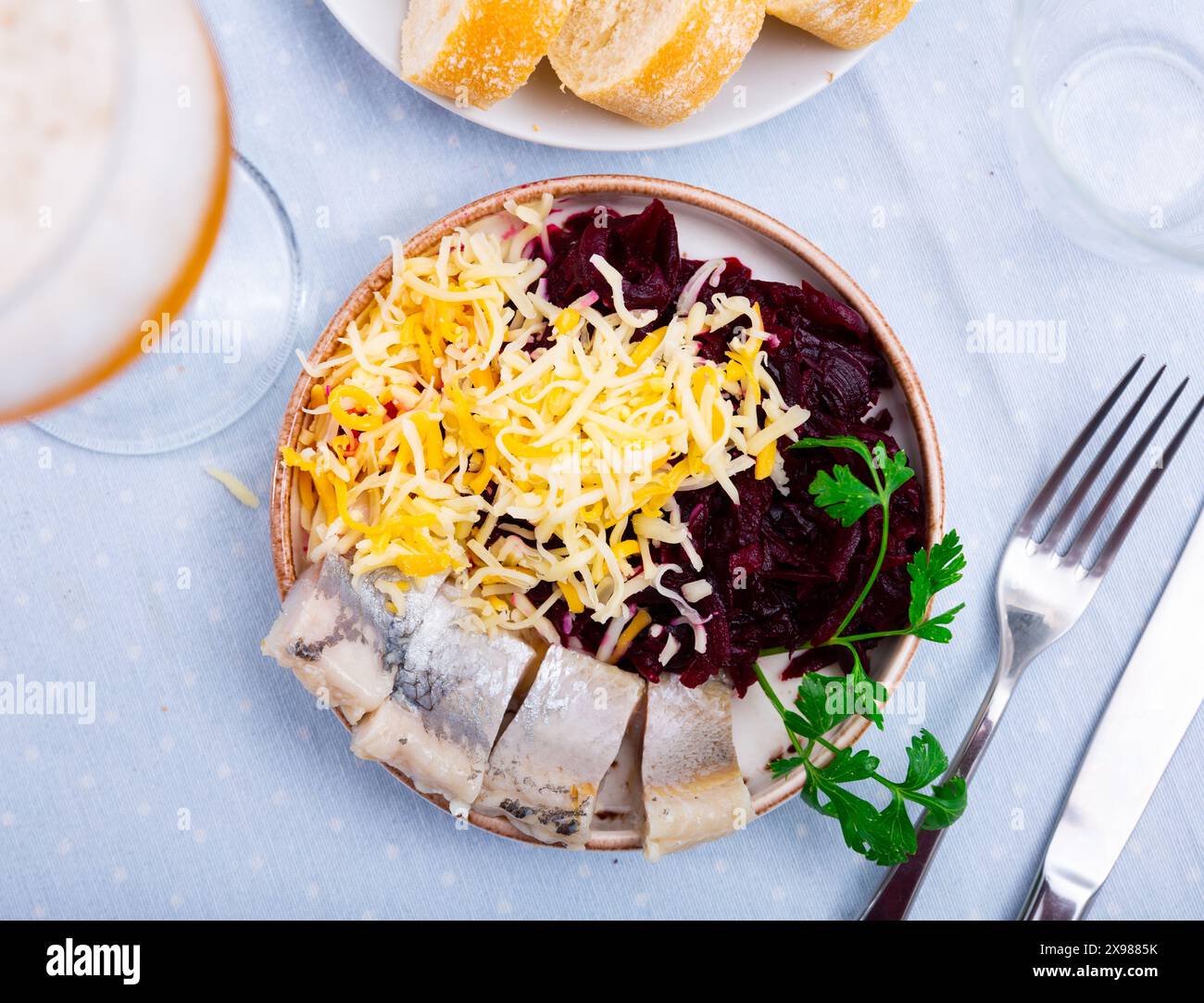 Beetroot served with cheese and pickled mackerel Stock Photo