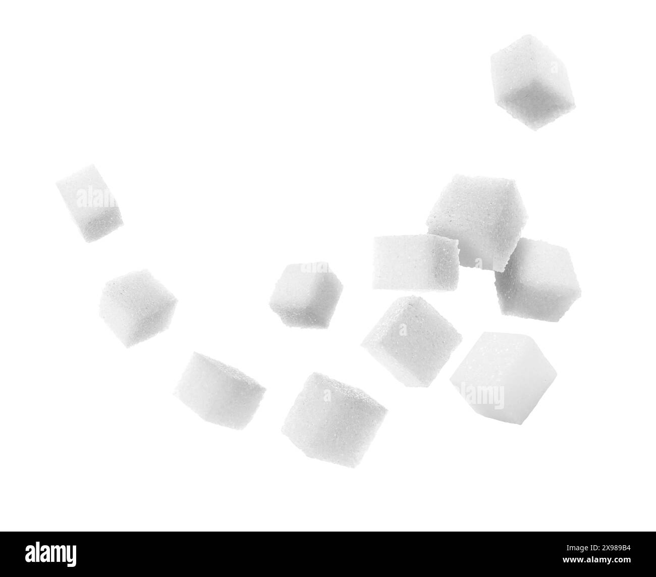 Refined sugar cubes in air on white background Stock Photo