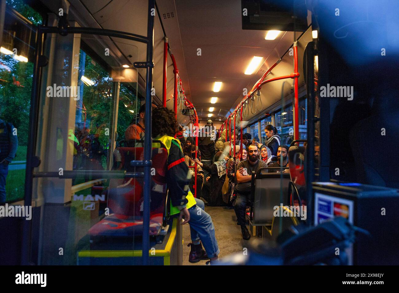 Pro-Palestinian demonstrators arrested and moved away from the site by bus, during today's 'Hands of Rafah' demonstration in The Hague. A few hundred pro-Palestinian protesters stood opposite the 'Tweede Karmer' or, the 'Second Chamber' the Dutch seat of government in The Hague, during todayís 'Hands off Rafah - Where is your red line Rutte?'. The demonstrators stood in pouring rain, some with megaphones, and demanding the Dutch government change its stance in its support of Israel. The demonstration was in response to Rafah on Sunday, in which 45 people were killed, according to the Humas-run Stock Photo