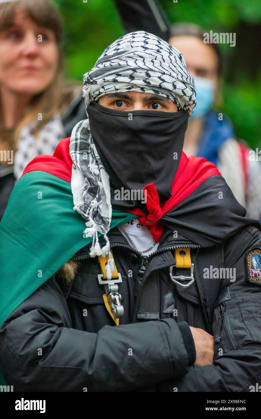 Pro-Palestinian male supporter, wearing a Keffiyeh a symbol of Palestinian nationalism, during today's 'Hands of Rafah' demonstration in The Hague. A few hundred pro-Palestinian protesters stood opposite the 'Tweede Karmer' or, the 'Second Chamber' the Dutch seat of government in The Hague, during todayís 'Hands off Rafah - Where is your red line Rutte?'. The demonstrators stood in pouring rain, some with megaphones, and demanding the Dutch government change its stance in its support of Israel. The demonstration was in response to Rafah on Sunday, in which 45 people were killed, according to t Stock Photo