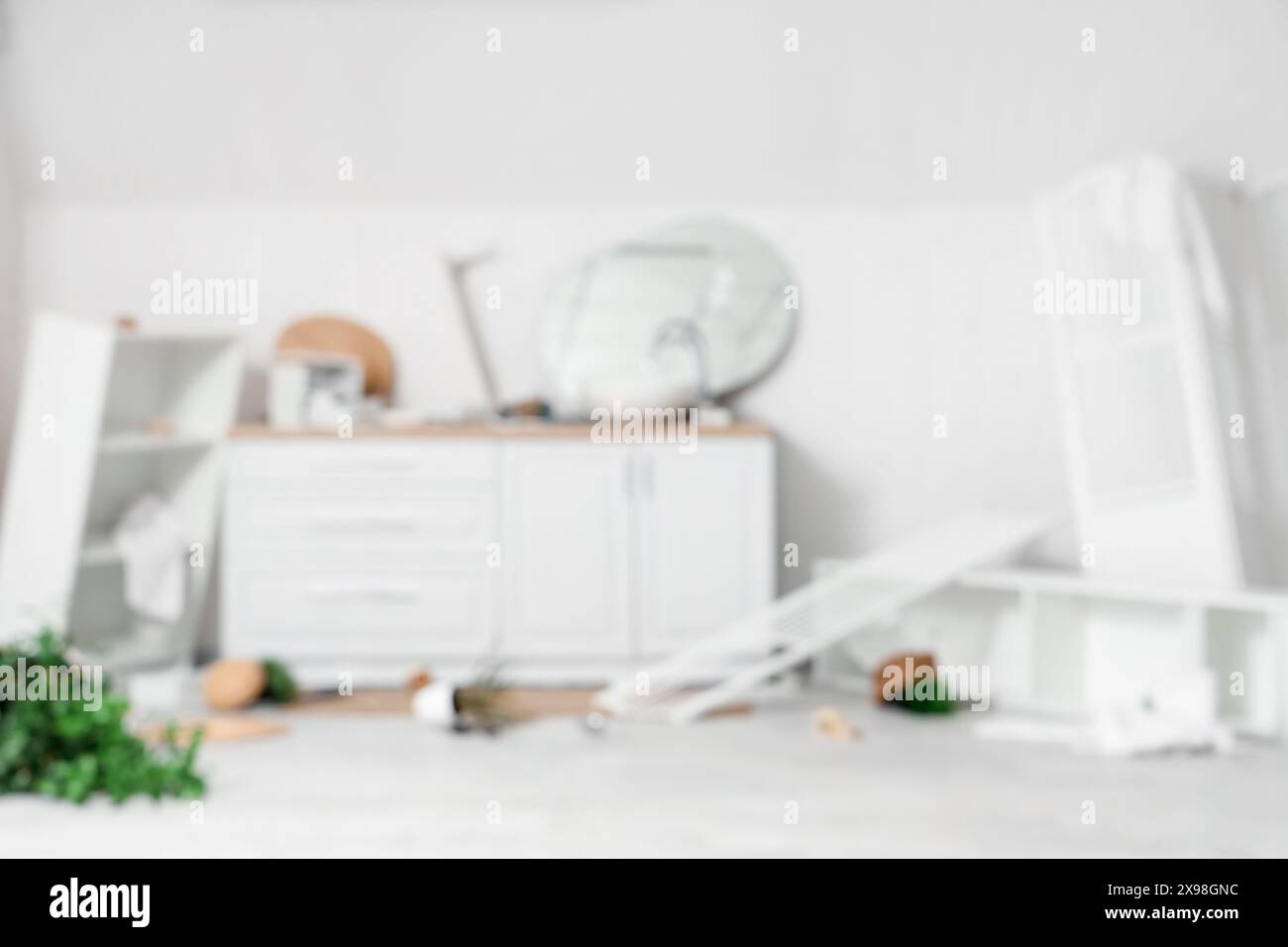 Blurred view of messy bathroom with counters and overturned things Stock Photo