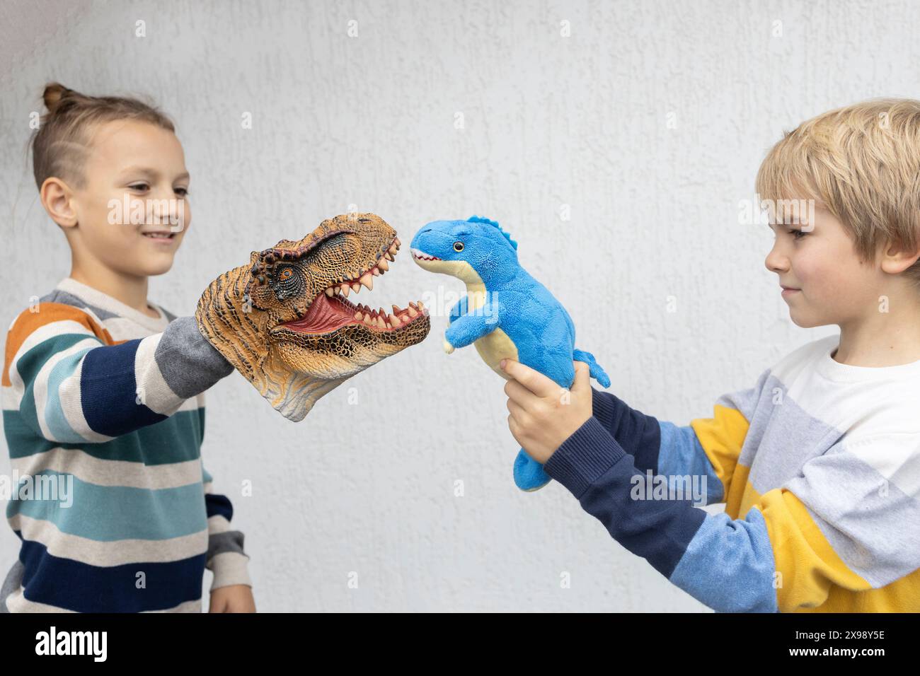 Two Elementary School Boys Have Fun Playing Role playing Games With 