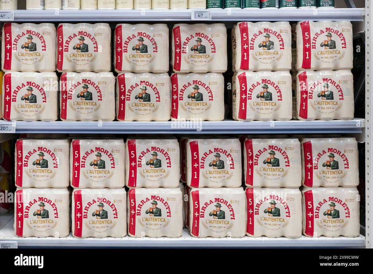 Birra Moretti L'autentica beer on supermarket shelves, Italian brand from 1895, known for traditional brewing methods and high-quality ingredients Stock Photo