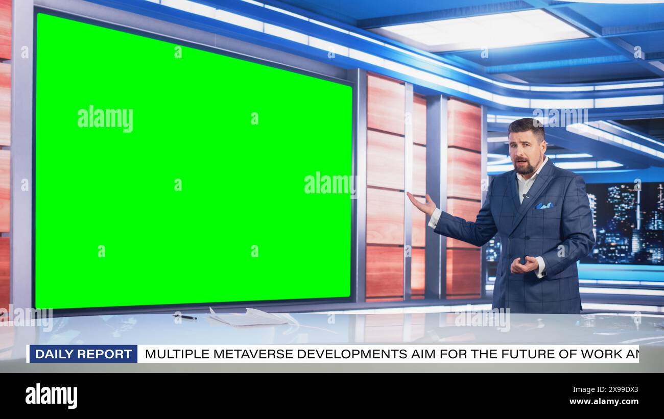 Talk Show TV Program: Handsome White Male Presenter Standing in Newsroom Studio, Uses Big Green Chroma Key Screen. News Achor, Host Talks About News, Weather. Mock-up Cable Channel Concept. Stock Photo