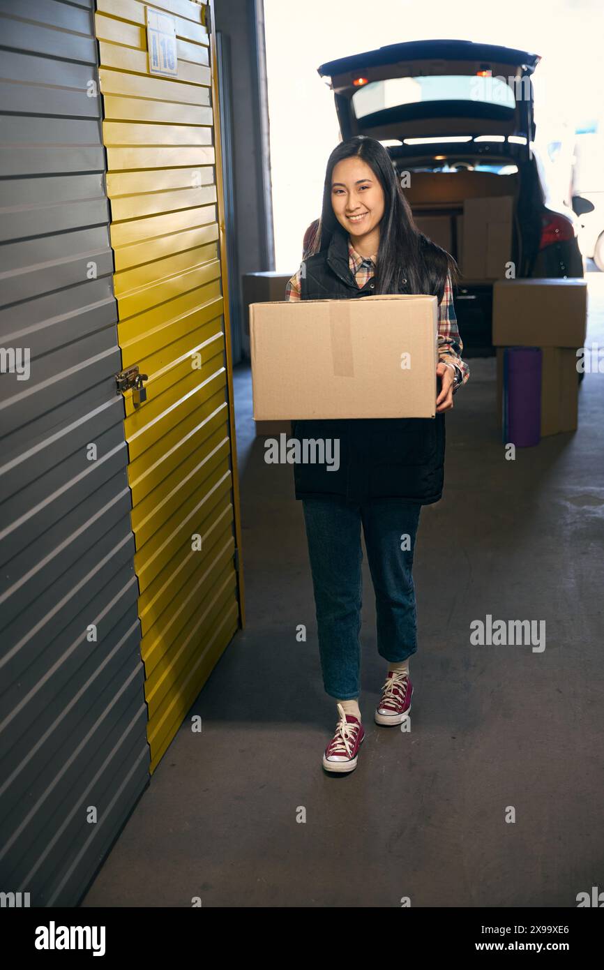 Happy woman unpacks boxes hi-res stock photography and images - Alamy