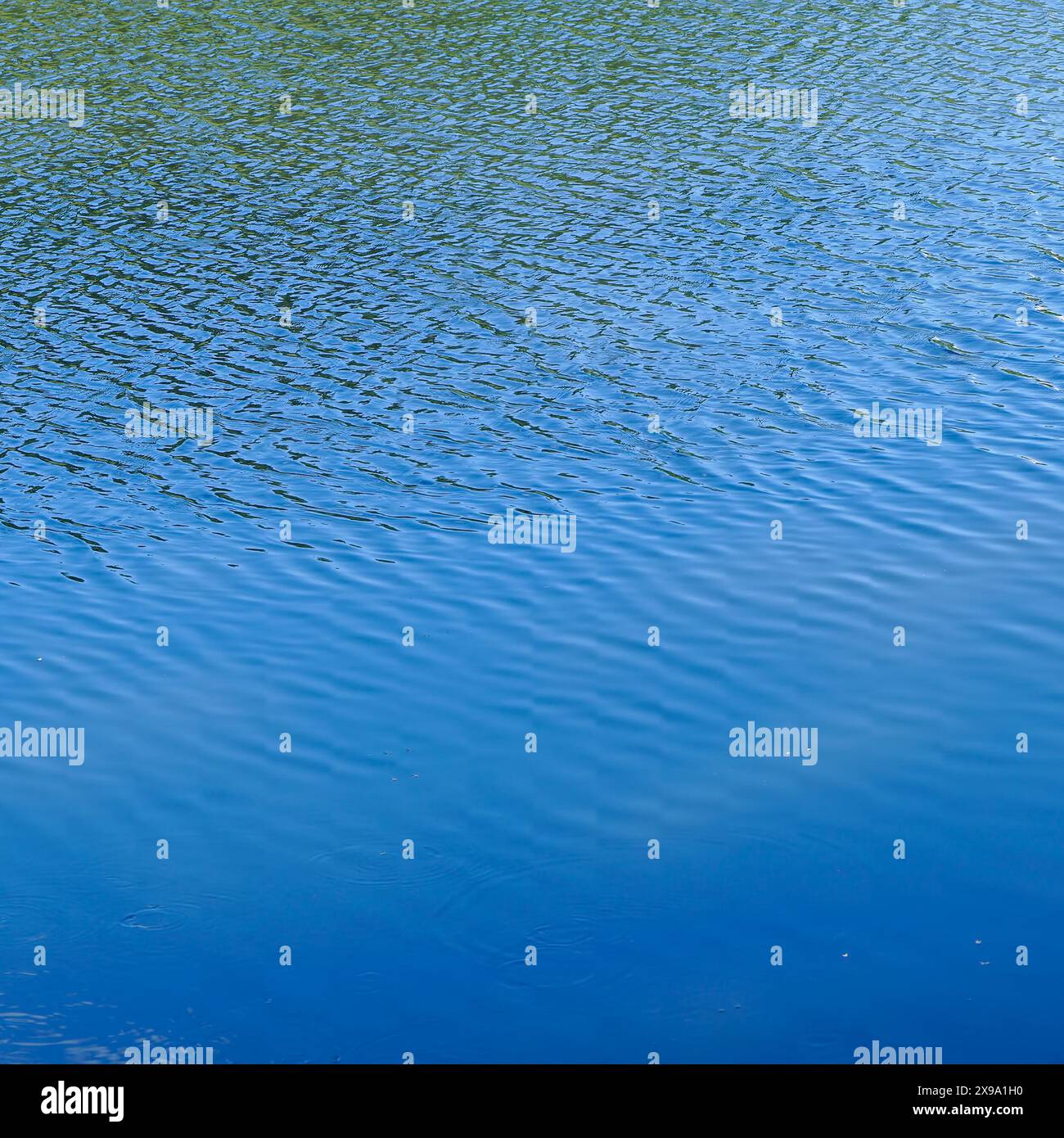Light ripples on the blue river water Stock Photo
