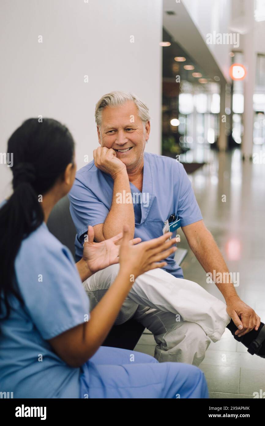 Group happy doctors discussing hi-res stock photography and images - Alamy