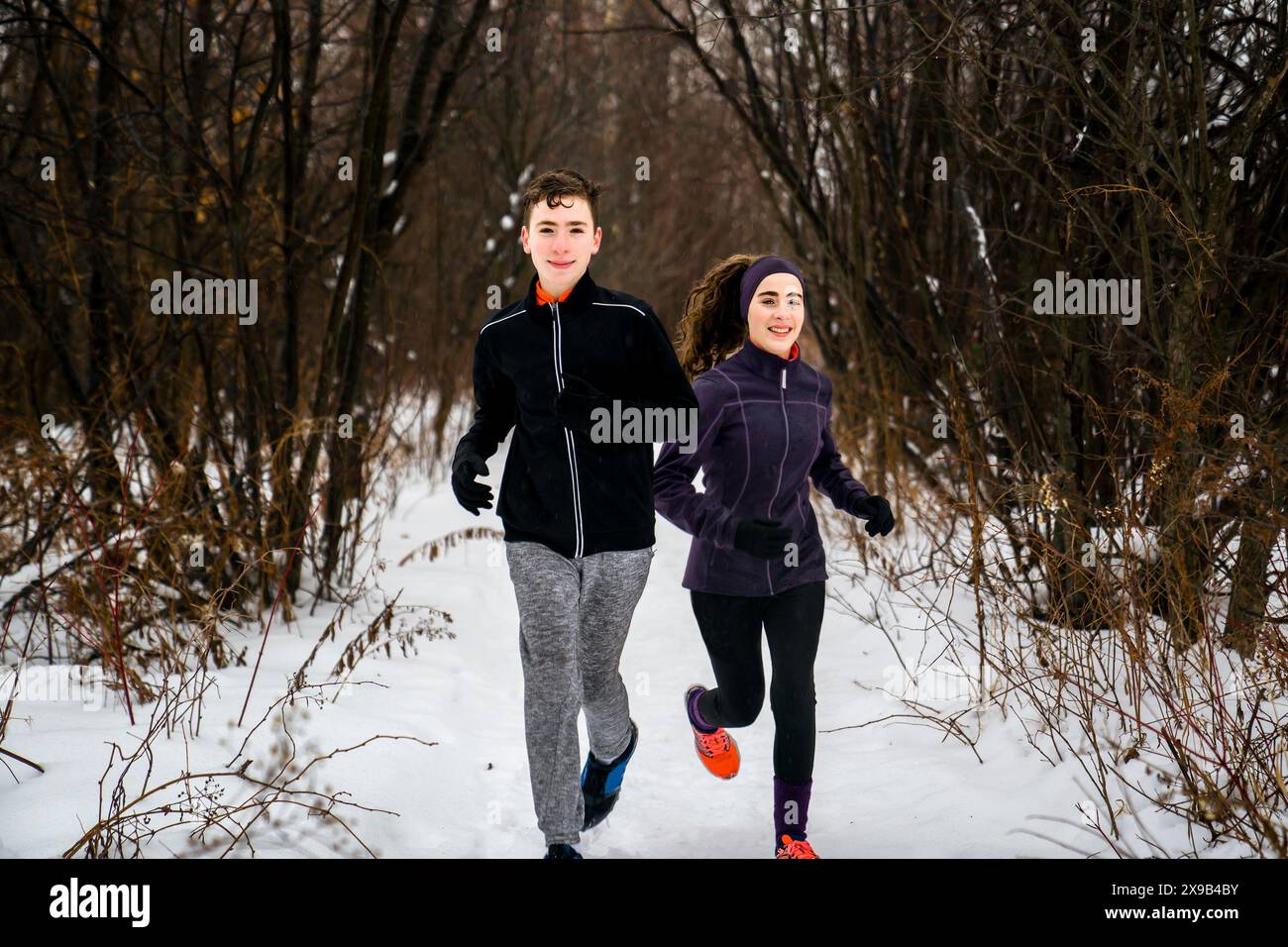 Brother sister running in forest hi-res stock photography and images ...