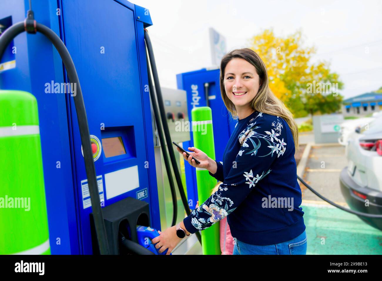 Woman inserts plug electrical socket hi-res stock photography and ...