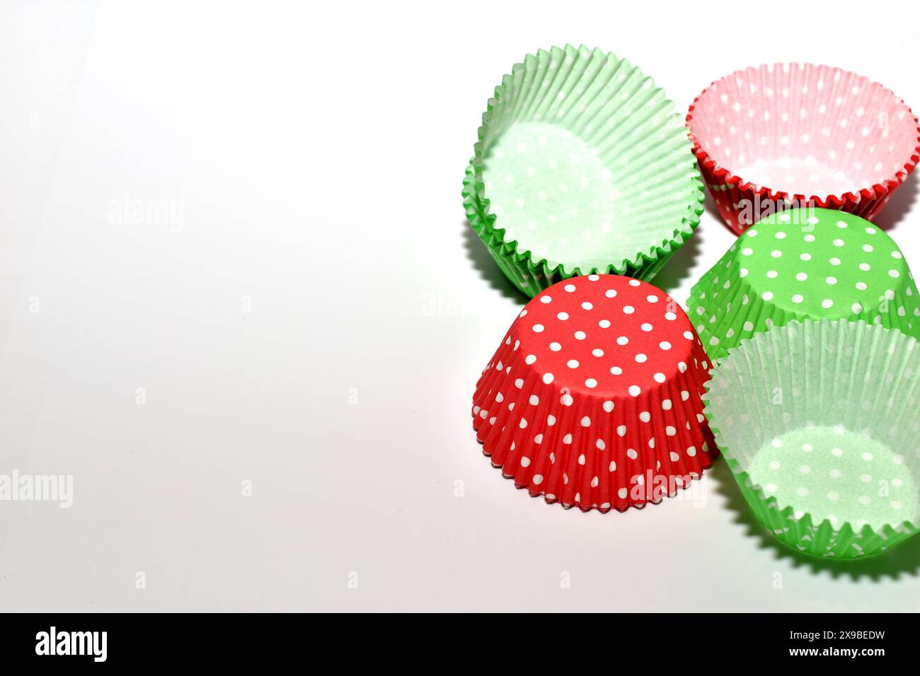 Disposable paper molds, different colors, for baking cupcakes. Stock Photo