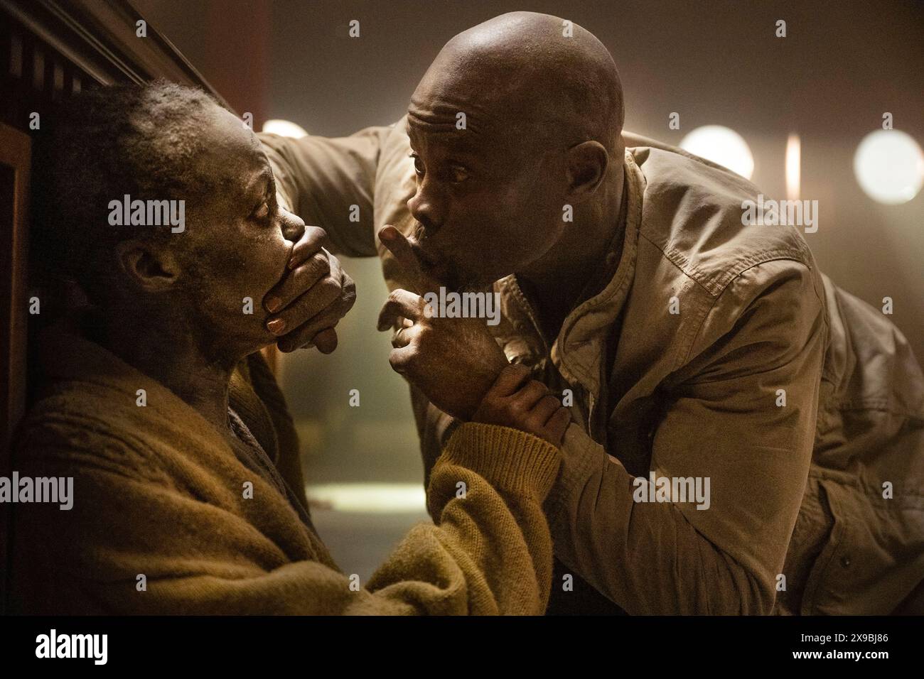 A Quiet Place: Day One (2024) directed by Michael Sarnoski and starring Lupita Nyong'o and Djimon Hounsou. Hear how it all began and experience the day the world went quiet. Publicity photograph ***EDITORIAL USE ONLY***. Credit: BFA / Gareth Gatrell / Paramount Pictures Stock Photo