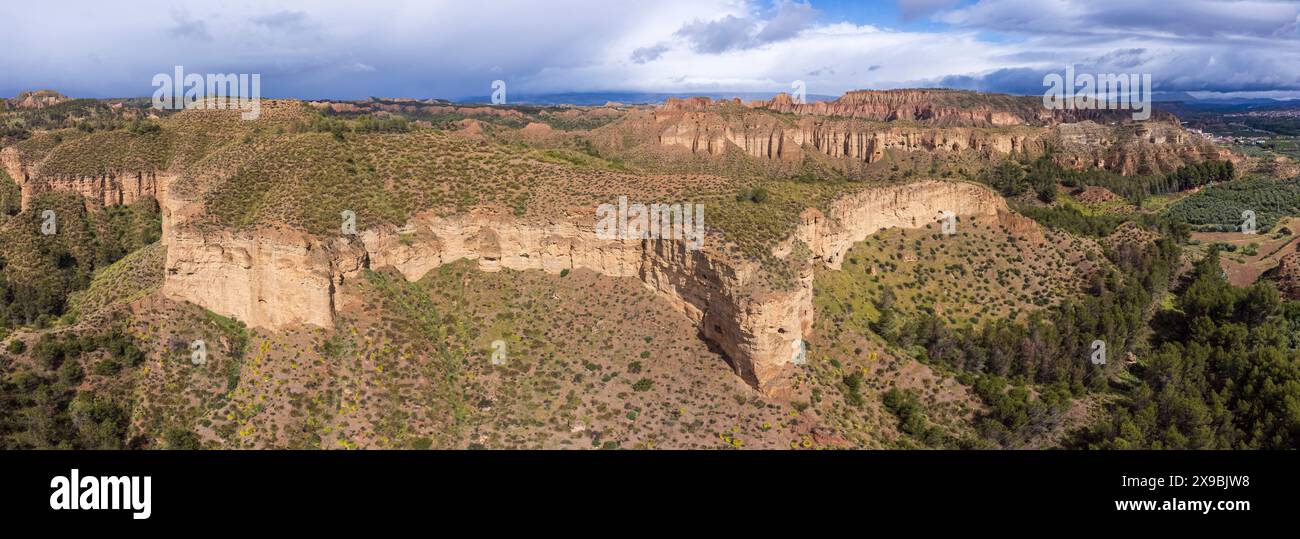 troglodyte granaries in the rock walls of Lares, Granada Geopark, Granada province, Andalusia, Spain Stock Photo