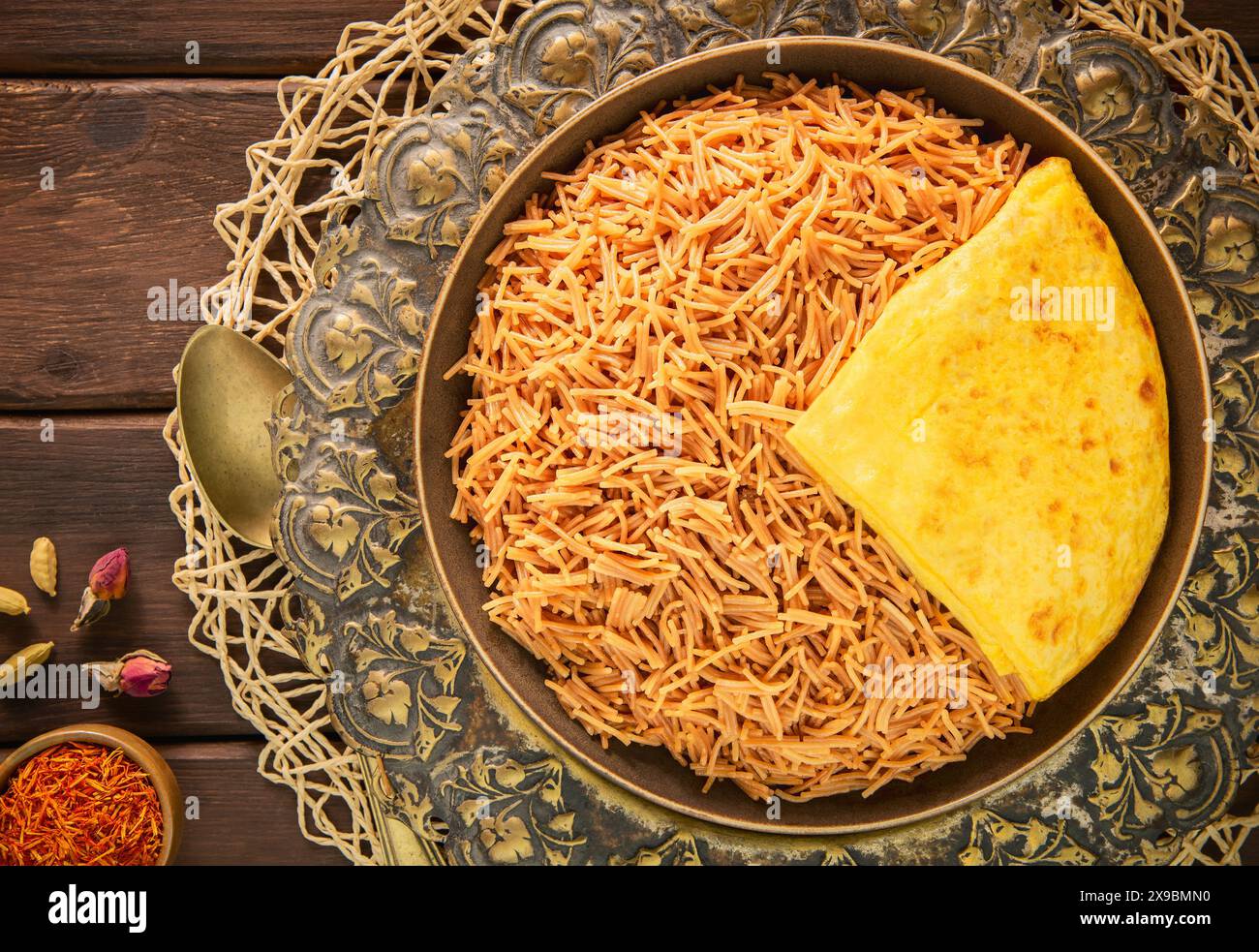 Arabic Cuisine; 'Balaleet' is a traditional Gulf Middle Eastern dish. Delicious toasted vermicelli noodles topped with an egg omelet. Stock Photo