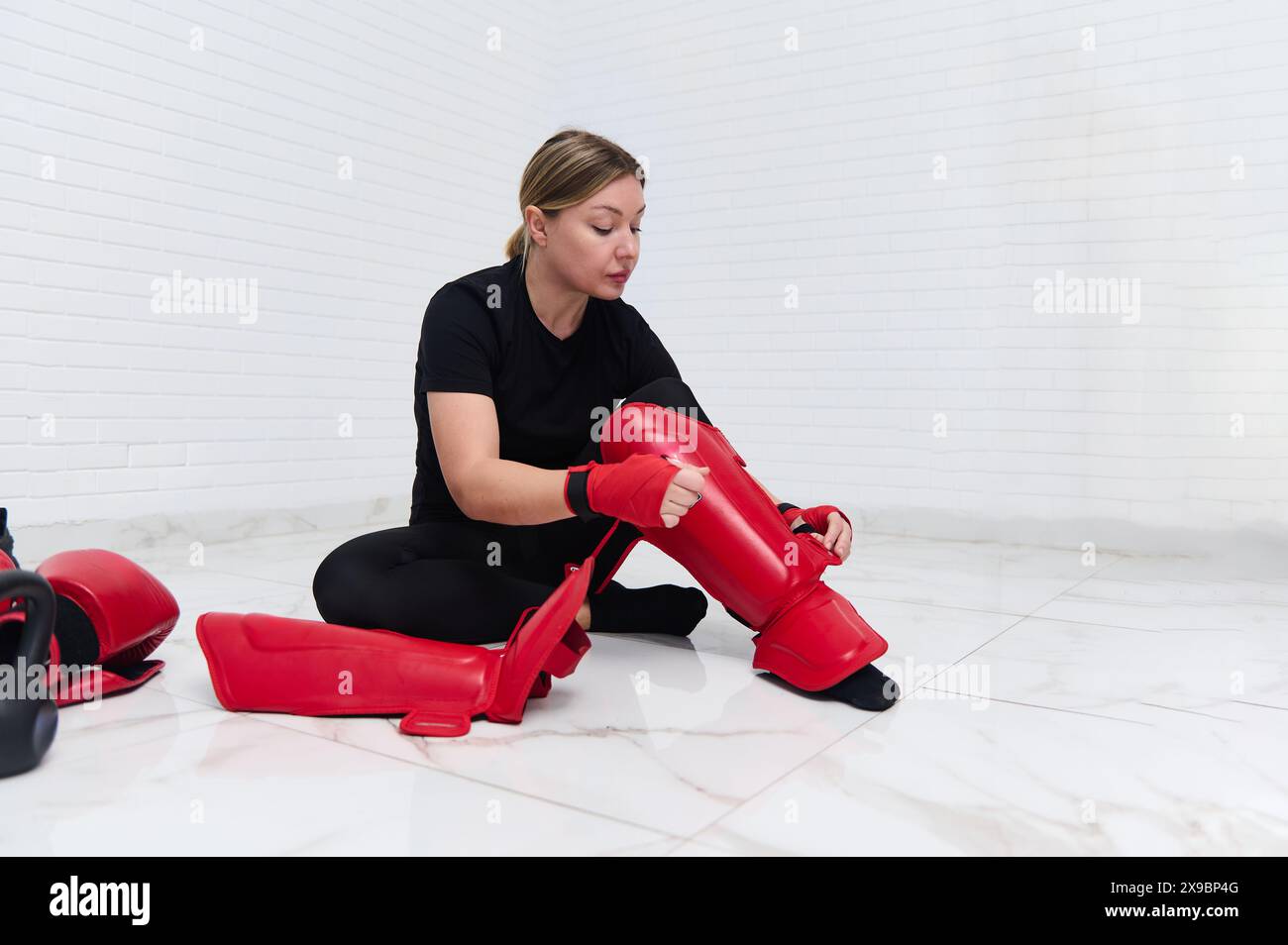 Putting on shin guard hi-res stock photography and images - Alamy