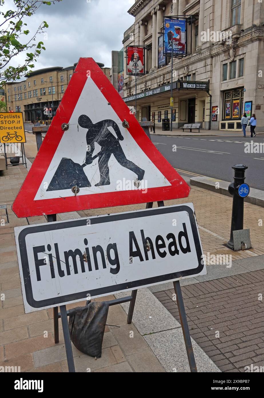 Filming Ahead sign,  in Lime Street,Liverpool City Centre, Merseyside, L1 1JD Stock Photo