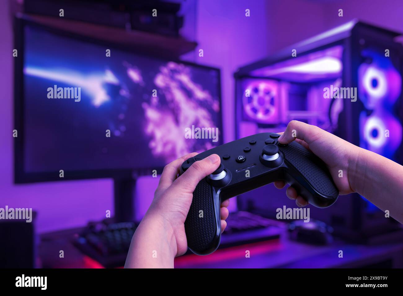 Immersive gaming setup featuring a gamer playing on a gaming PC with a