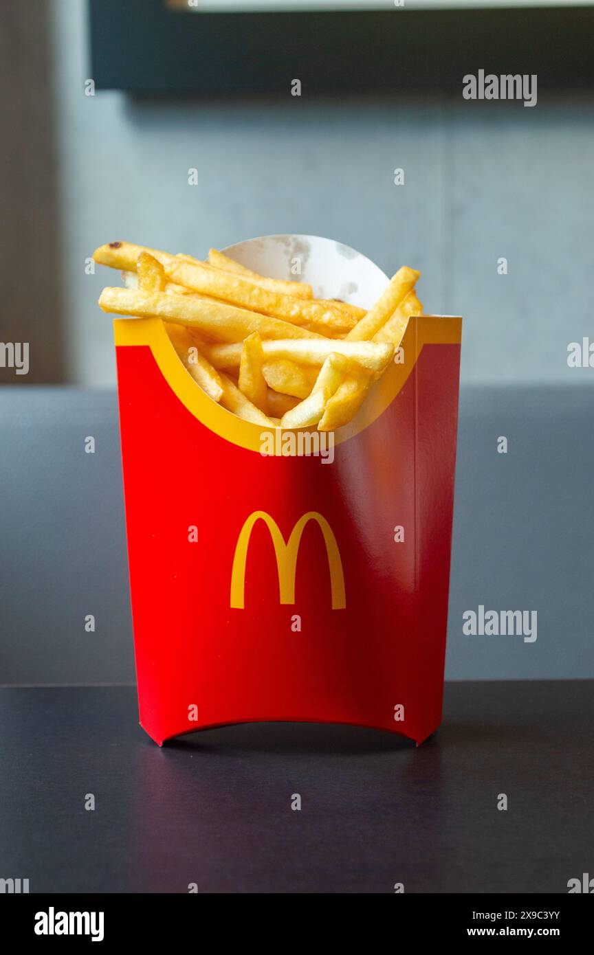 Antwerp, Belgium - February 24, 2024: McDonald french fries in red box. Stock Photo