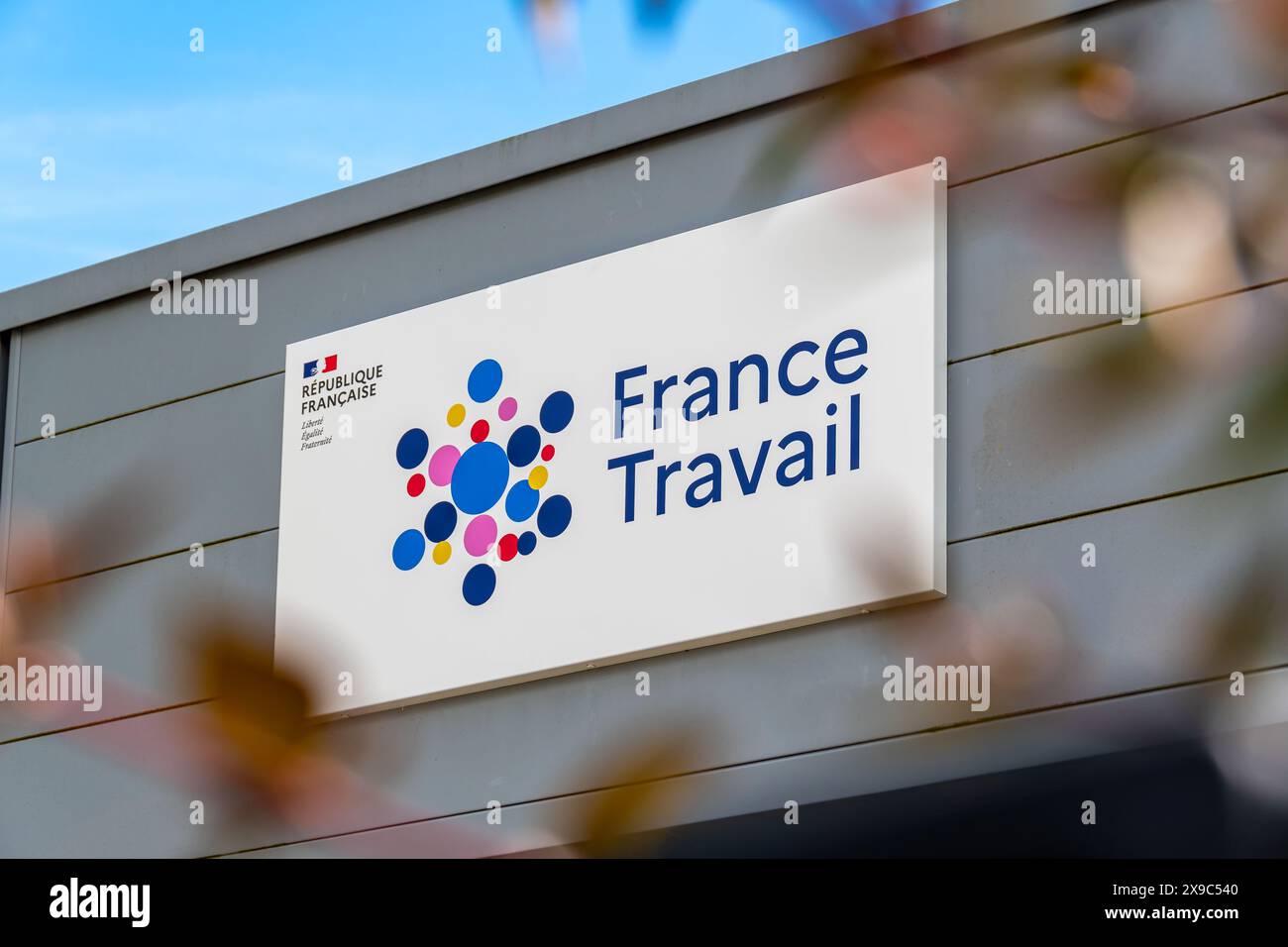 Sign and logo at the entrance to a France Travail agency. France Travail, formerly Pôle Emploi, is the French administration in charge of employment Stock Photo