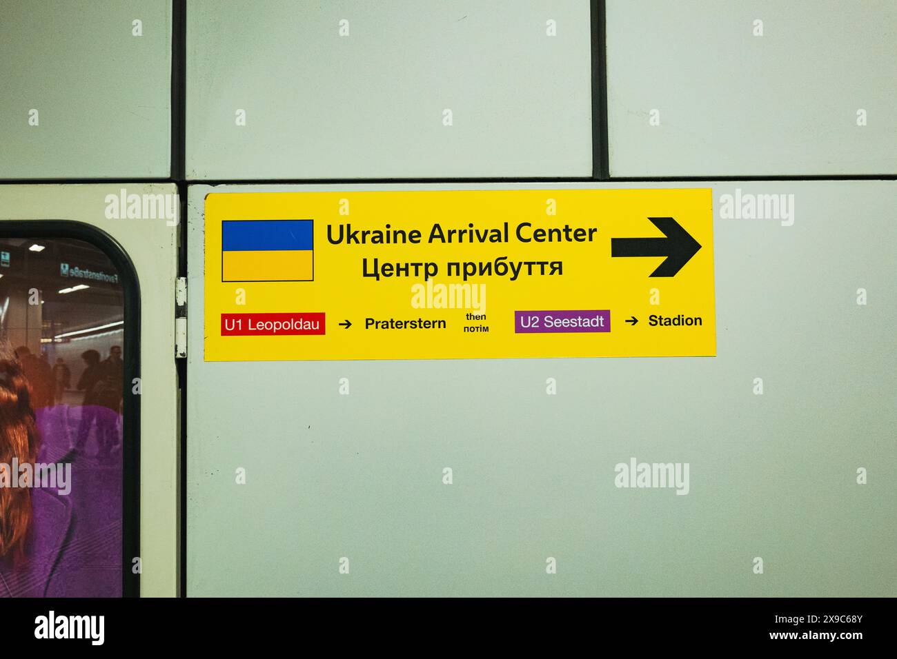 Ukraine Arrival Center sign for Ukrainian war refugees in subway tunnel
