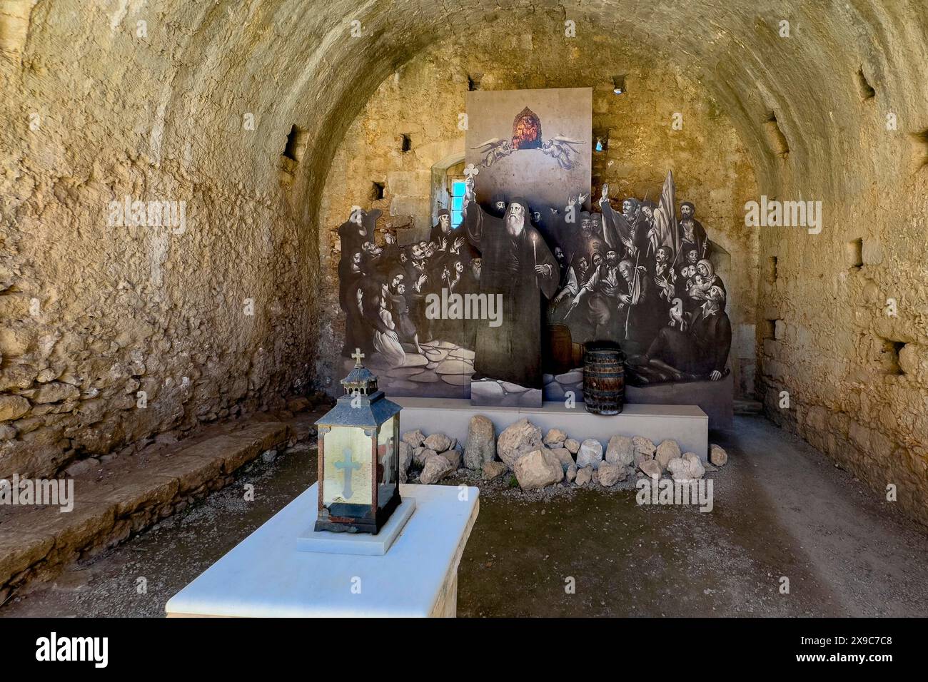 View of memorial for victims of monks inhabitants of Arkadi monastery in former wine cellar later powder room in the form of copy part of painting by Stock Photo