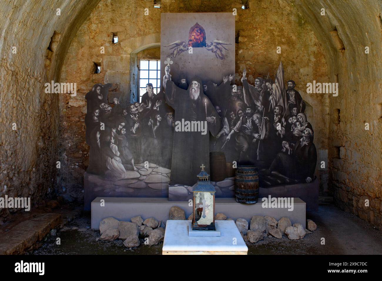 View of memorial for victims of monks inhabitants of Arkadi monastery in former wine cellar later powder room in the form of copy part of painting by Stock Photo