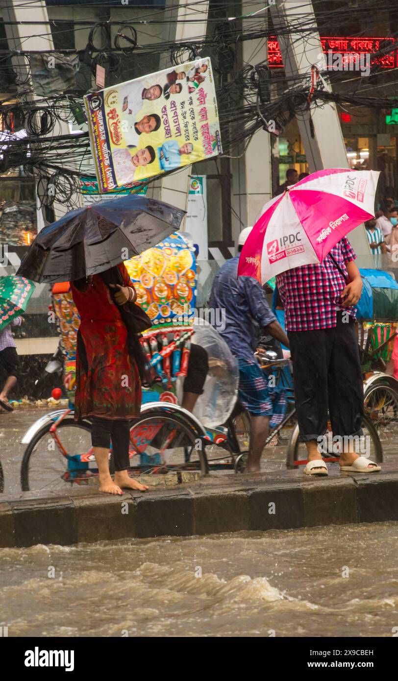 Cyclone Remal caused heavy rainfall, flooding, and strong winds in Dhaka City, leading to disrupted transport, power outages, and significant property Stock Photo