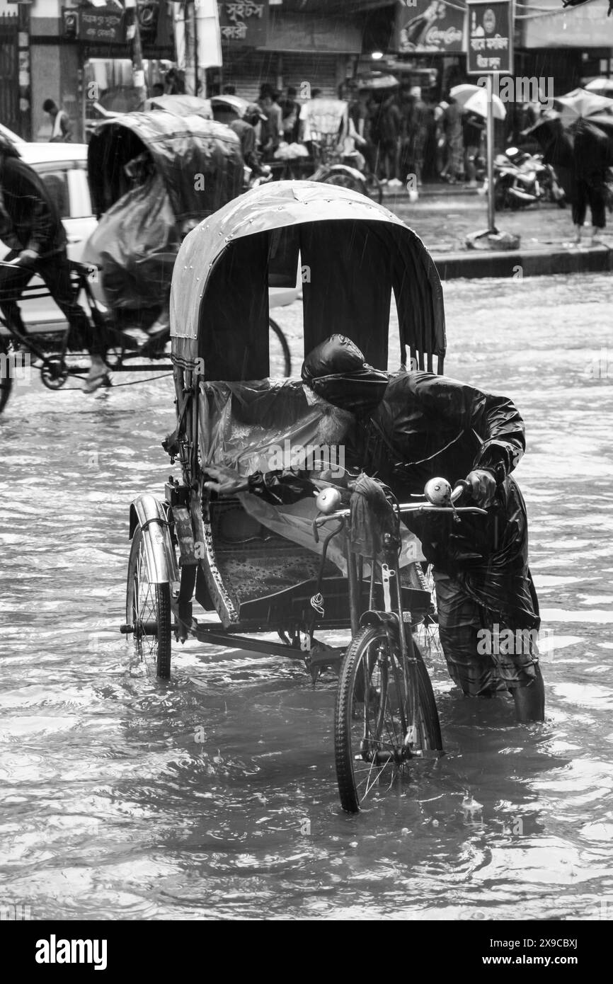 Cyclone Remal caused heavy rainfall, flooding, and strong winds in Dhaka City, leading to disrupted transport, power outages, and significant property Stock Photo