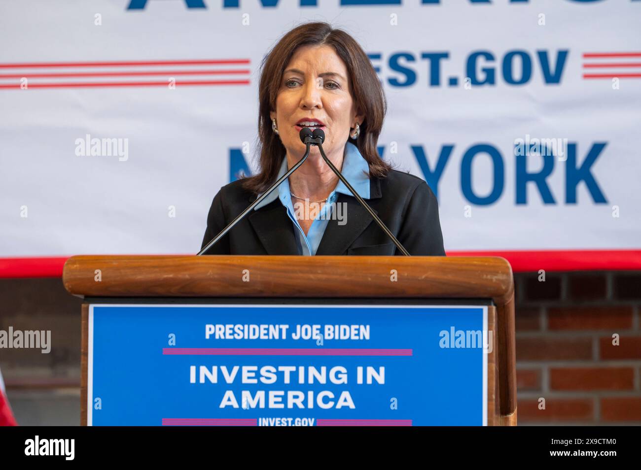 NEW YORK, NEW YORK - MAY 30: New York State Governor Kathy Hochul speaks during a clean energy affordability announcement at the Andromeda Community Initiative, Long Island City on May 30, 2024 in the Queens Borough of New York City. Governor Kathy Hochul joined U.S. Department of Energy (DOE) Secretary Granholm, White House Senior Advisor John Podesta and Majority Leader U.S. Senator Chuck Schumer to celebrate New York State becoming the first state in the nation to offer the first phase of Inflation Reduction Act (IRA) Home Electrification and Appliance Rebates (HEAR) Program funding to con Stock Photo