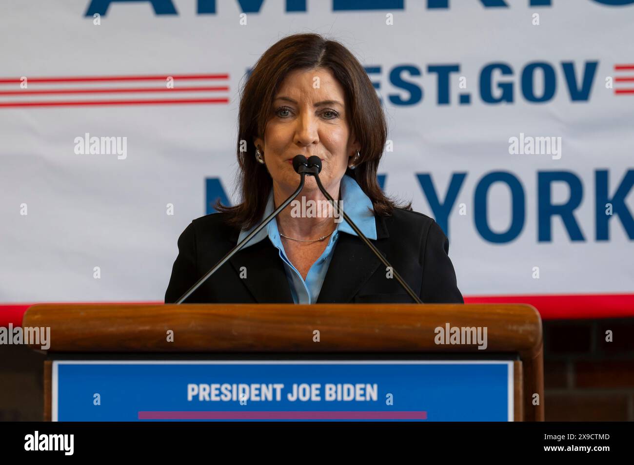 NEW YORK, NEW YORK - MAY 30: New York State Governor Kathy Hochul speaks during a clean energy affordability announcement at the Andromeda Community Initiative, Long Island City on May 30, 2024 in the Queens Borough of New York City. Governor Kathy Hochul joined U.S. Department of Energy (DOE) Secretary Granholm, White House Senior Advisor John Podesta and Majority Leader U.S. Senator Chuck Schumer to celebrate New York State becoming the first state in the nation to offer the first phase of Inflation Reduction Act (IRA) Home Electrification and Appliance Rebates (HEAR) Program funding to con Stock Photo