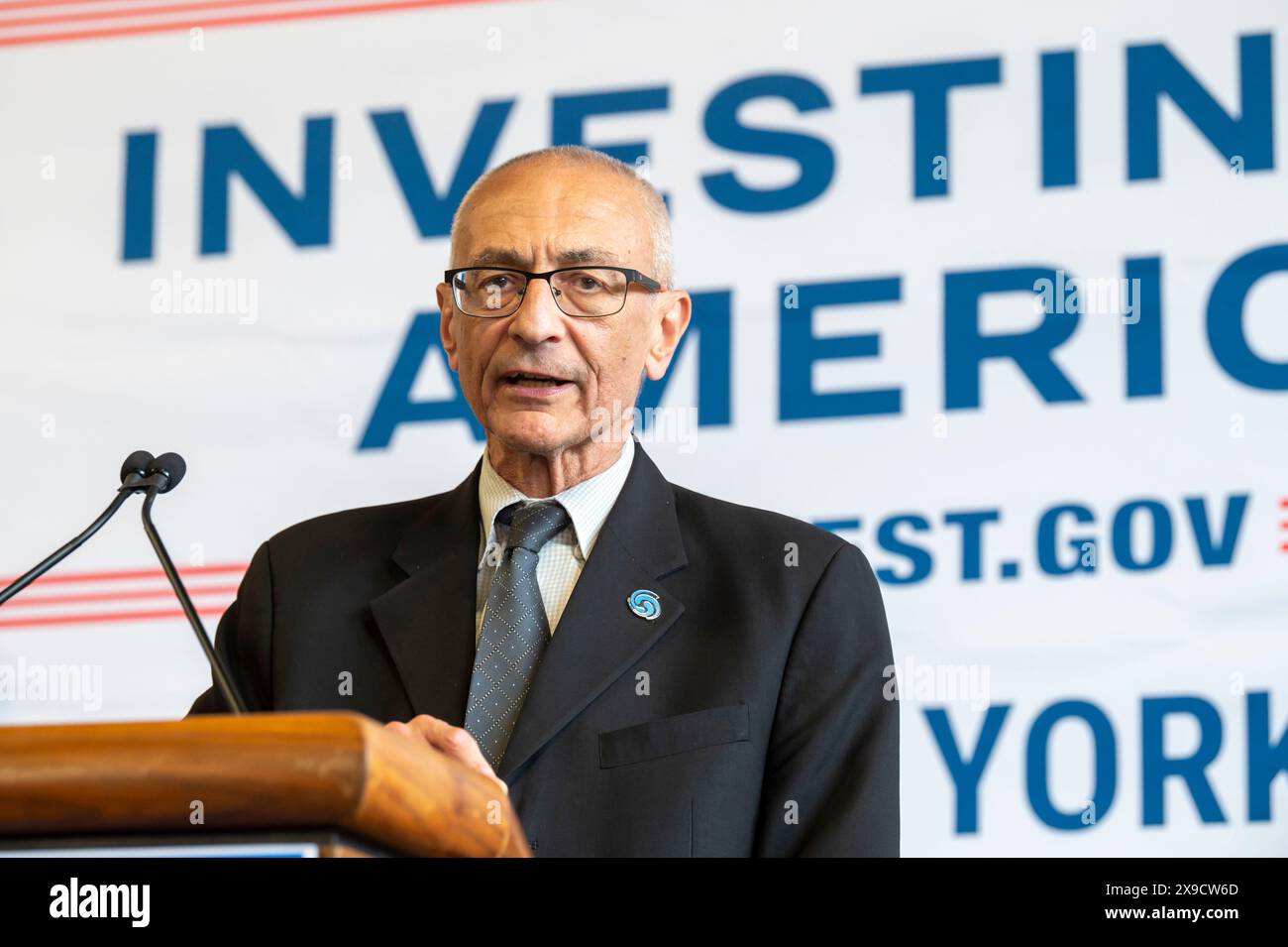 NEW YORK, NEW YORK - MAY 30: White House Senior Advisor John Podesta speaks during a clean energy affordability announcement at the Andromeda Community Initiative, Long Island City on May 30, 2024 in the Queens Borough of New York City. Governor Kathy Hochul joined U.S. Department of Energy (DOE) Secretary Granholm, White House Senior Advisor John Podesta and Majority Leader U.S. Senator Chuck Schumer to celebrate New York State becoming the first state in the nation to offer the first phase of Inflation Reduction Act (IRA) Home Electrification and Appliance Rebates (HEAR) Program funding to Stock Photo