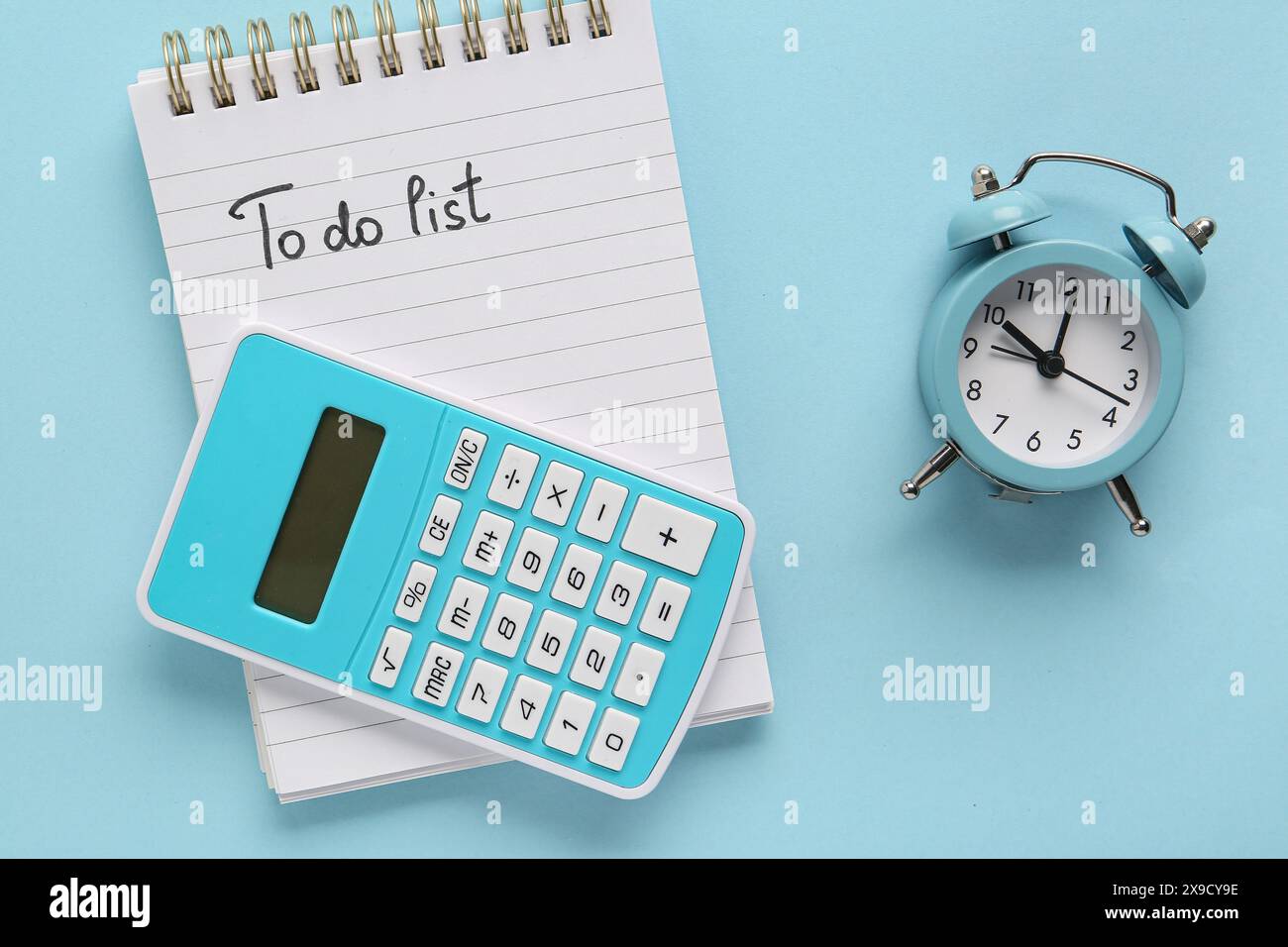 Time Taskfor Notebook Notebook with text TO DO LIST, alarm clock and calculator on blue ...