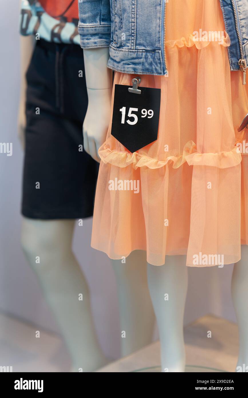 Price tag on a dress in a shop window in the old town of Bruges in ...