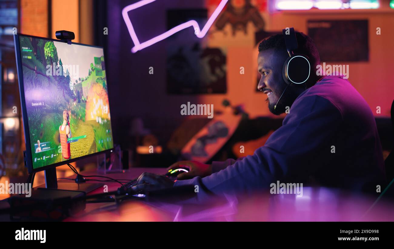 Professional black gamer playing in hi-res stock photography and images ...