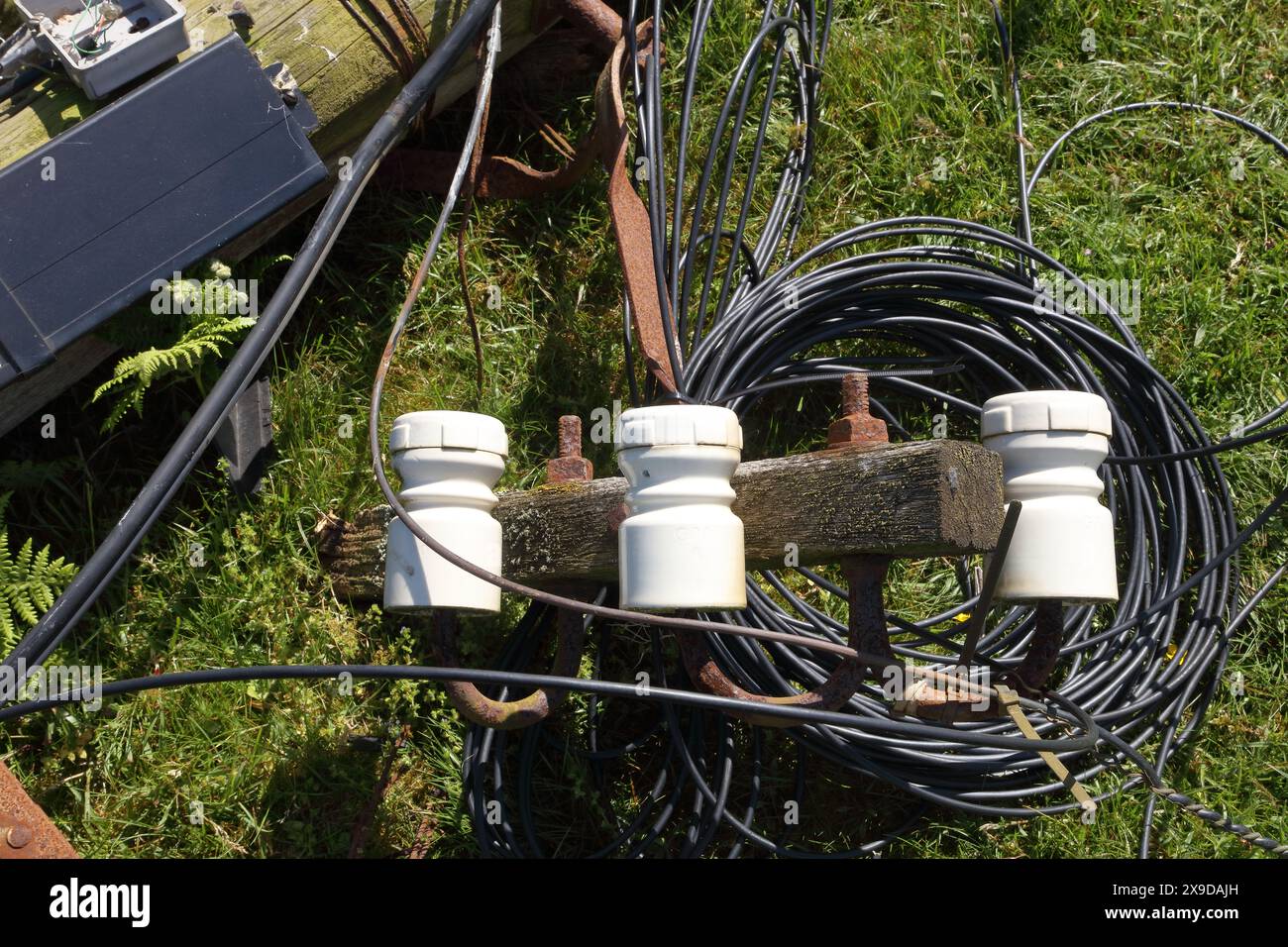 A roadside casualty of a driving accident with a heavy vehicle having hit a telegraph pole and snapped it knocking the top part over. Stock Photo