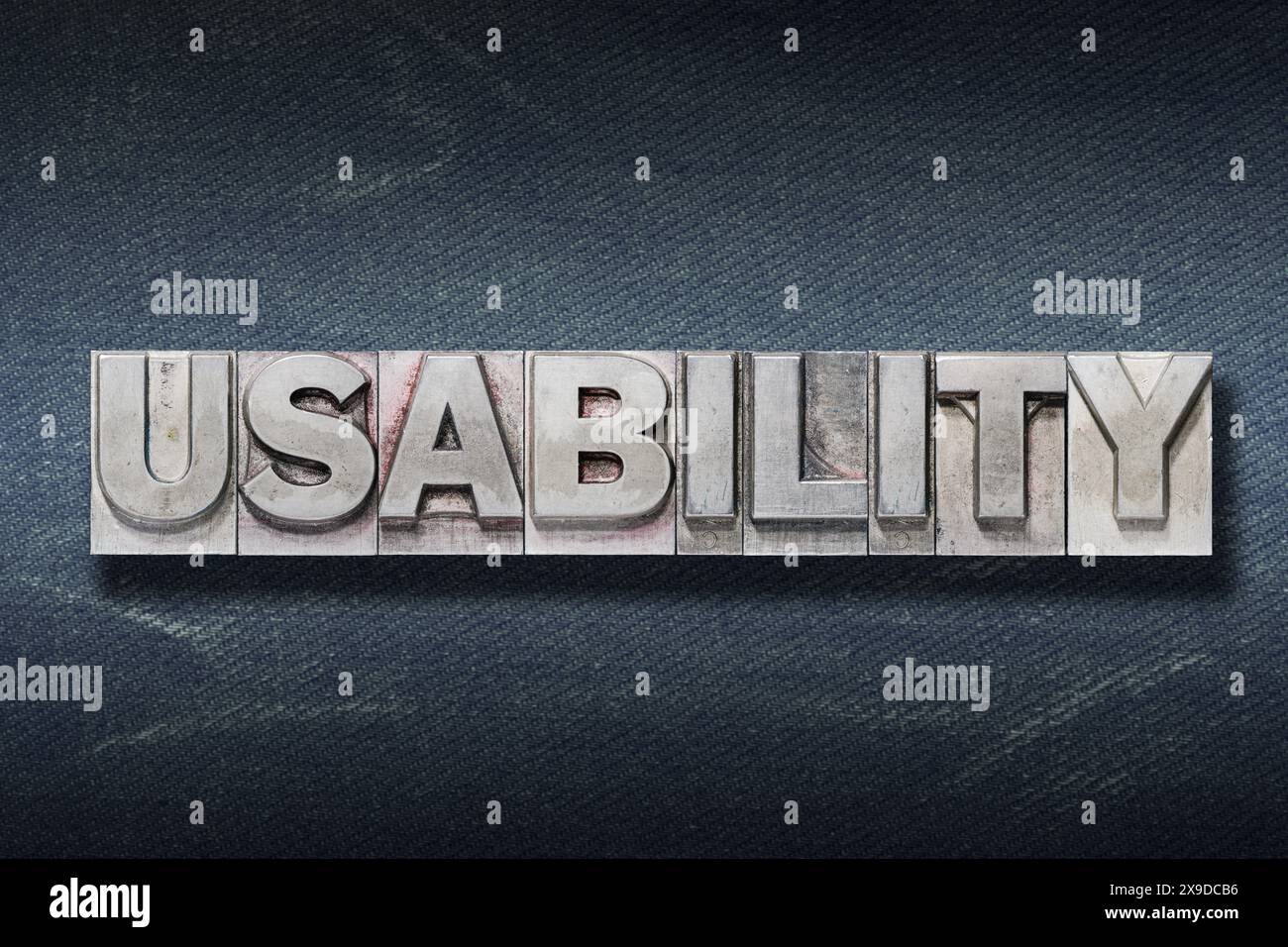 usability word made from metallic letterpress on dark jeans background Stock Photo
