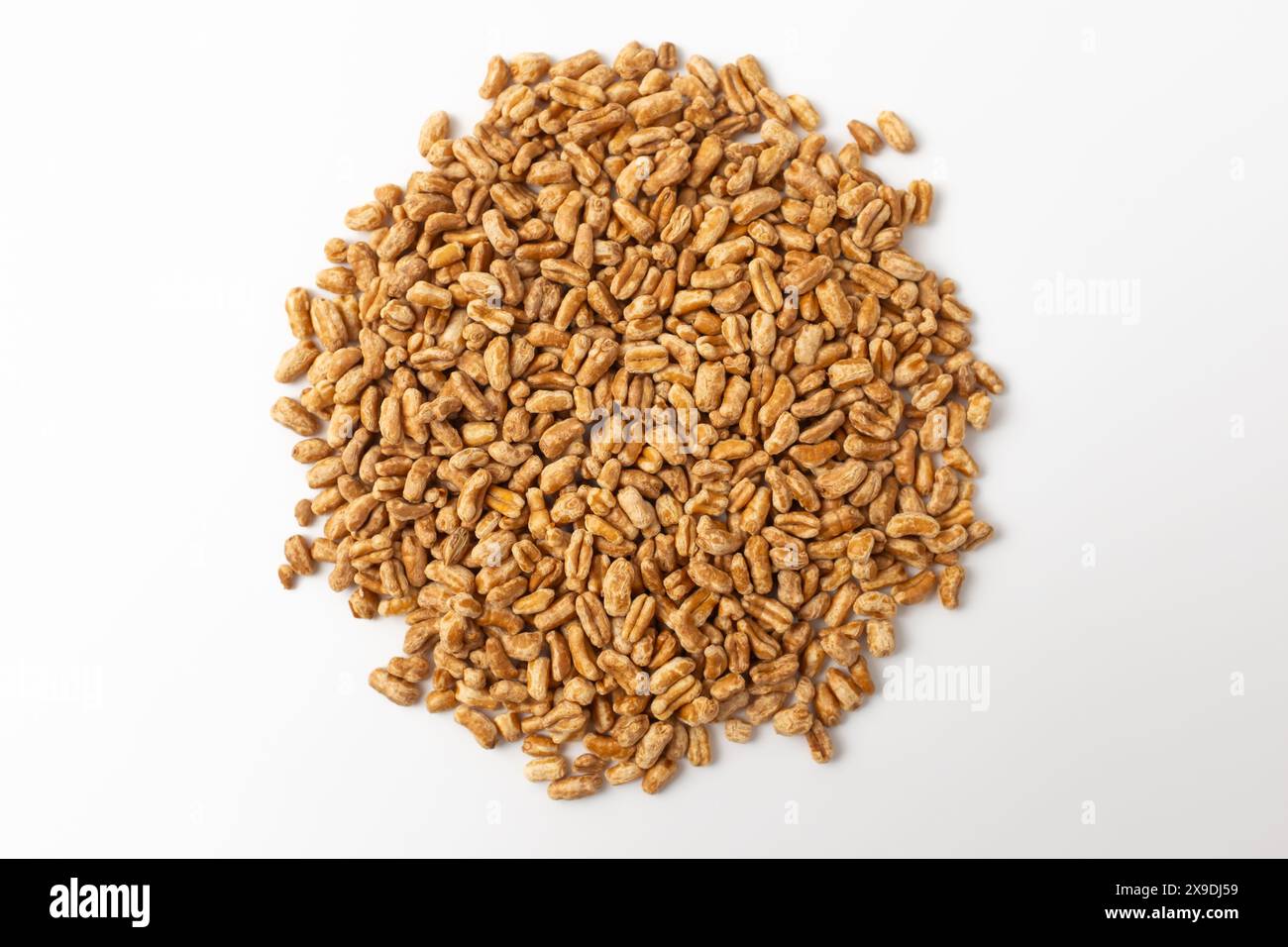 Roasted kamut on white background Stock Photo