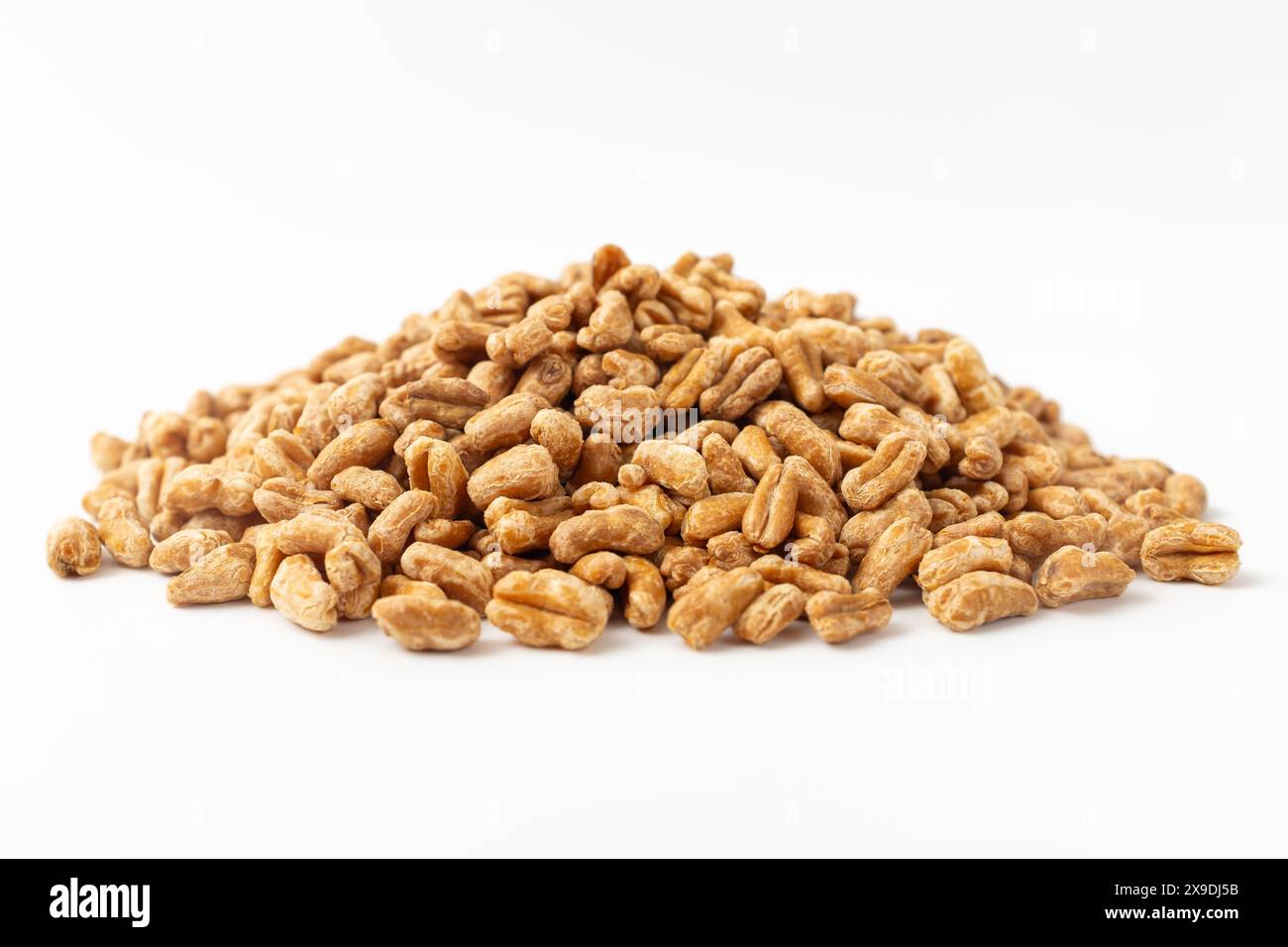 Roasted kamut on white background Stock Photo