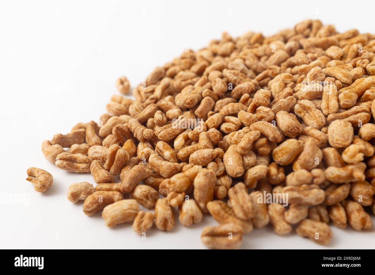Roasted kamut on white background Stock Photo